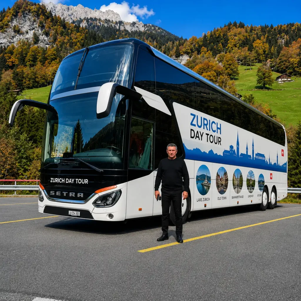 Enver standing beside the Zurich Day Tour luxury coach in the Swiss Alps before a guided day tour.